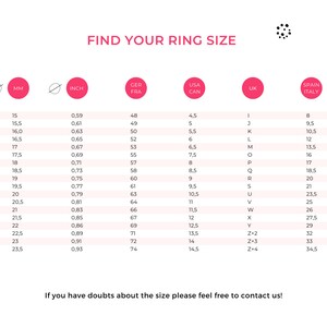 May include: A chart showing ring sizes in millimeters, inches, US, UK, French, Spanish, and Italian sizes. The chart includes a range of sizes from 15 mm to 23.5 mm.