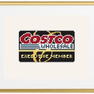 May include: Cross-stitch artwork of a Costco Wholesale Executive Member card. The design features the Costco logo in red and white, with the words "WHOLESALE" and "EXECUTIVE MEMBER" in a pixelated style, set against a black background.