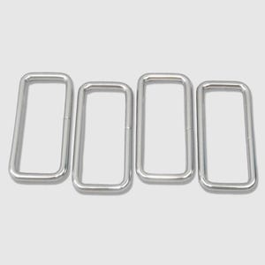 May include: Four silver-colored rectangular metal rings arranged horizontally. The rings are made of a thick, rounded metal and have a smooth, shiny finish. They are evenly spaced against a light gray background.