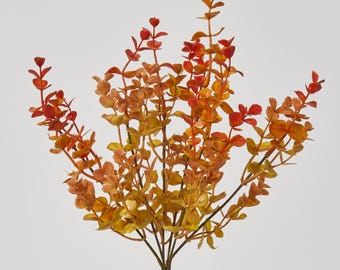 May include: A bunch of artificial fall foliage with red and yellow leaves. The leaves are arranged in a cluster and have a realistic appearance.