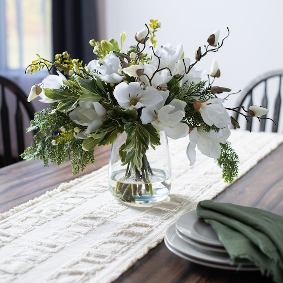 White Magnolia, Mixed Greens & Berry Everyday Winter Floral Arrangement  Centerpiece in Tapered Glass Vase -  Israel