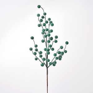 May include: A decorative floral spray featuring numerous small, round berries covered in a vibrant green glitter finish. The berries are attached to thin, branching brown stems that extend from a single central stalk, creating a branched structure.