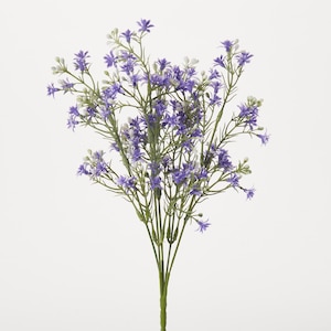 May include: A bouquet of artificial purple flowers with white centers. The flowers are arranged on green stems.