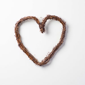 May include: A brown twig heart-shaped wreath.