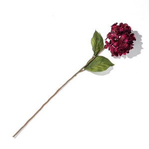 May include: A single stem artificial flower with a deep red hydrangea bloom and green leaves.