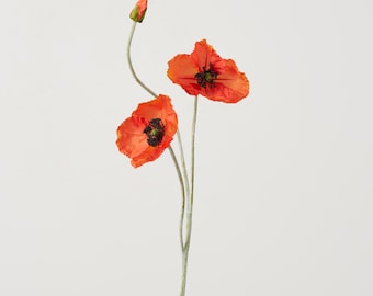 May include: A single stem of artificial orange poppies with three open blooms. The flowers have a delicate, crinkled texture.