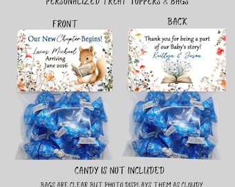May include: Clear treat bags filled with blue wrapped candies. The front of the bag features a floral design with the text "Our New Chapter Begins!" and baby details. The back says "Thank you for being a part of our Baby's story!"
