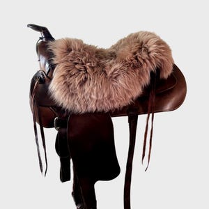 Beige sheepskin saddle seat cover