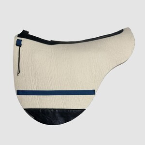 May include: A white sheepskin saddle pad with a black leather trim and a blue strap.