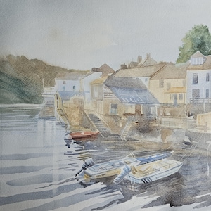 May include: A watercolor painting of a harbor scene with several buildings along the waterfront. The buildings are painted in shades of brown and white, and there are several boats docked in the water. The water is a light blue color, and the sky is a light gray color.