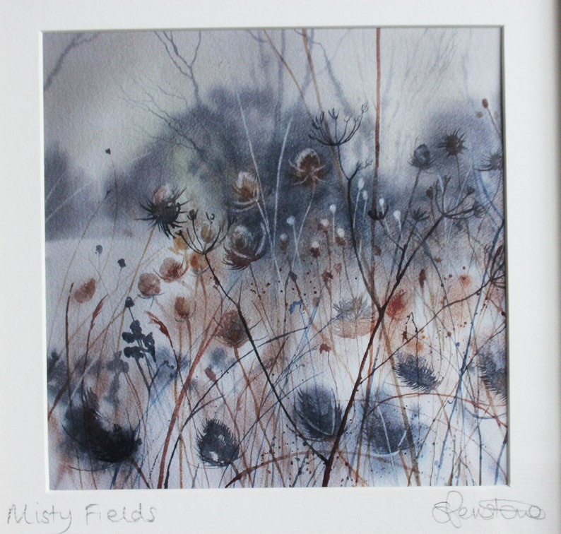 May include: A watercolor painting of a misty field with tall, dried grasses and wildflowers. The painting is done in shades of gray, brown, and blue, with a soft, ethereal feel.