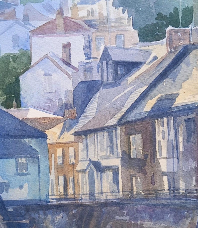 May include: Watercolor painting of a row of houses with slate roofs and white windows. The houses are painted in shades of blue, brown, and beige. The painting is done in a realistic style.
