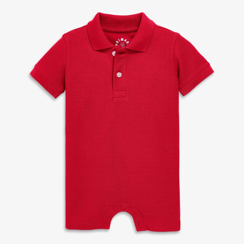 May include: A solid red baby romper with a polo collar and short sleeves. The romper has a three-button placket and snaps at the bottom. The brand name is visible on the collar.