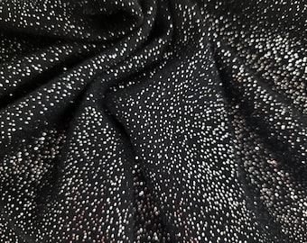 May include: Black fabric with a subtle sparkle from silver glitter dots.