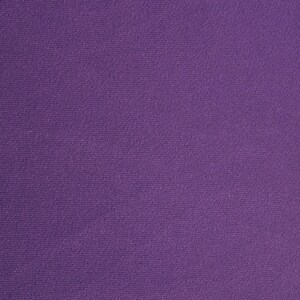 May include: A solid purple fabric with a textured surface.