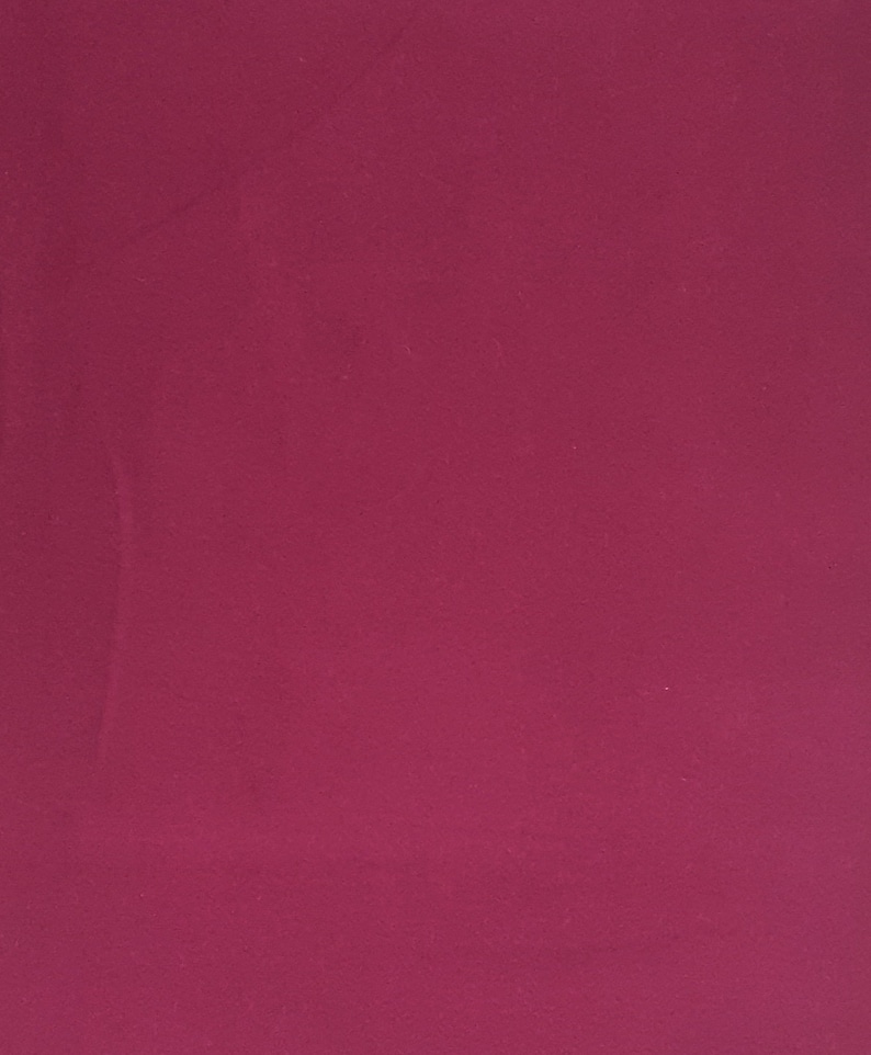 May include: Solid magenta background. The image is a close-up of a smooth, evenly colored surface. The color is a deep, rich shade of magenta, with no visible patterns or textures.