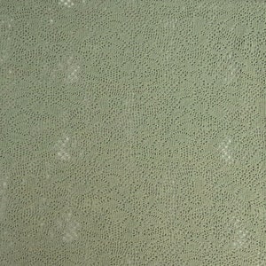 May include: A close-up of a light green textured fabric with a subtle pattern. The fabric has a slightly rough texture and a soft, muted color.
