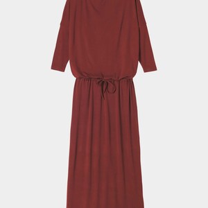 May include: A long, burgundy-colored dress with a drawstring waist and three-quarter sleeves.
