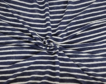 May include: White and navy blue striped fabric with a textured, linen-like appearance.