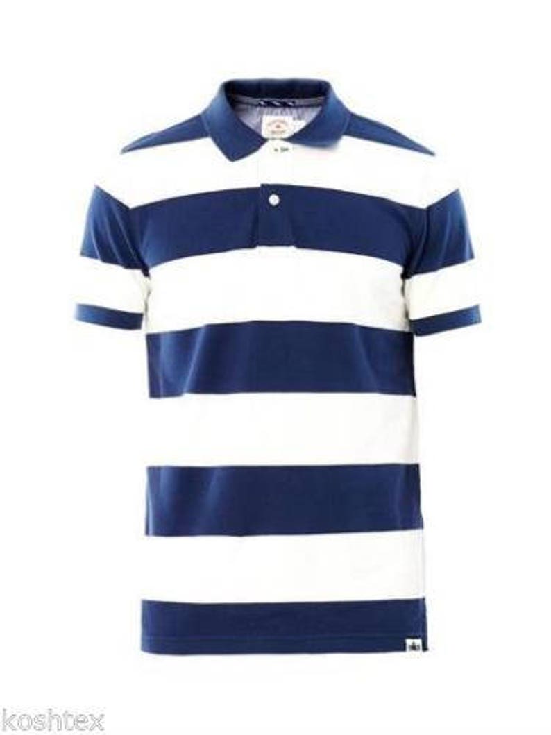 May include: A short-sleeved polo shirt with horizontal navy blue and white stripes. The shirt has a classic collar, a three-button placket, and a small logo near the hem. The shirt is made of a soft, breathable fabric.