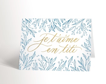 CARTE DE SOUHAIT avec une illustration de feuillage bleu et calligraphe je t'aime anniversaire mariage couple carte st-valentin