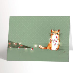 GREETING CARD Victorious cat | Humor | Illustration of a cat in a Christmas tree | Season&#39;s greetings | Green tree | 4,25&#39;&#39; X 5,5&#39;&#39;