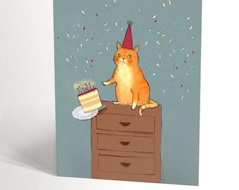 Carte de fête avec une illustration d'un chat roux qui fait tomber un gâteau d'anniversaire, humour cute avec un chat valerie boivin