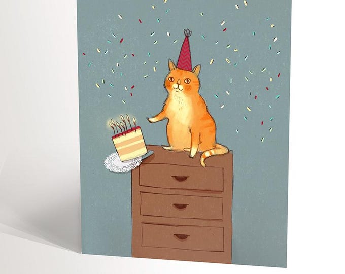 Tarjeta de cumpleaños con ilustración de un gato pelirrojo volcando una tarta de cumpleaños, humor tierno con un gato por Valerie Boivin