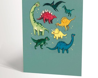 CARTE DE SOUHAIT avec une illustration de plusieurs dinosaures sur fond bleu, carte tyrannosaure t-rex velociraptor diplodocus