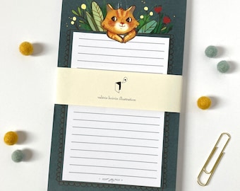 Handy NOTEPAD with a cute illustration of a red cat amongst flowers and leaves, perfect to write down things not to forget