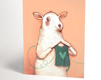 CARTE DE SOUHAIT illustration d'un mouton qui tricote un foulard de laine avec un dessin de coeur au centre, carte amitié tricot