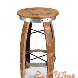 May include: A rustic wine barrel bar stool features a circular wooden top with the words 