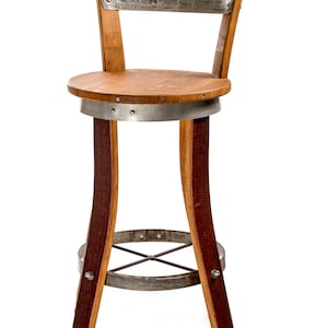 May include: A wine barrel bar stool with a wooden seat and a metal back. The stool is made from reclaimed wine barrels and has a rustic look. The stool is also available in a variety of colors and finishes. Eco-Wine Furniture