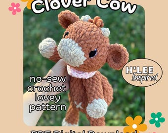 May include: A crochet pattern for a brown and white cow with a pink collar. The pattern is called "Clover Cow" and is a no-sew crochet lovey pattern. The pattern is available as a PDF digital download. The text "H'LEE Inspired" is also visible in the image.