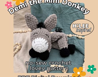 May include: A crochet pattern for a gray and black mini donkey, called "Demi the Mini Donkey". The pattern is a no-sew crochet lovey pattern and is available as a PDF digital download. The pattern is by H'LEE Inspired.