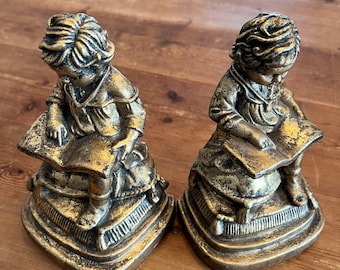 Gold colored Bookends of Child Reading