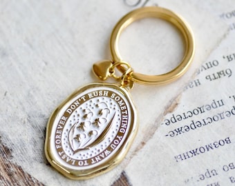 Enamel Message Wax Seal Keychain | Lily of the Valley | Don't rush something you want to last forever | Gold White | Backtozero