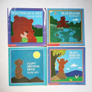 May include: Four children's books by Frank Asch. Titles include "Moonbear's Pet", "Bear Shadow", "Happy Birthday, Moon", and "Bear's Bargain". Each book features a colorful illustration of a bear on the cover, with a blue, green, and yellow color scheme.