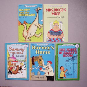 May include: A collection of six vintage children's books, featuring colorful illustrations and titles like "Danny and the Dinosaur" and "Mrs. Brice's Mice." The books are arranged on a light gray surface, showcasing their covers.