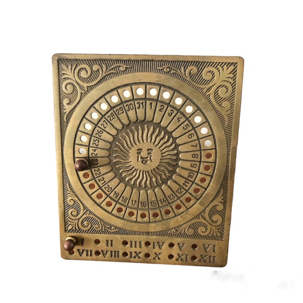 Eternal calendar made of brass with original pins. Copper-colored standing calendar. Very decorative interior object.