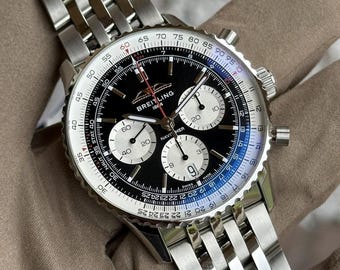 Reloj Breitling Aviator 8 vintage, sin usar, cronógrafo, fecha y día, esfera negra, brazalete de acero.
