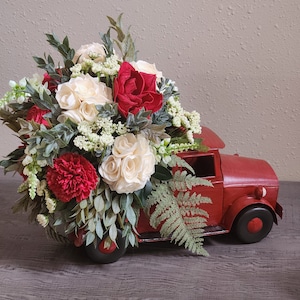 Red truck Christmas] Christmas truck decor] Red truck Sola Arrangement] Christmas truck flowers