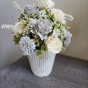 Wedding table centerpieces] silver Anniversary arrangement] white sola flower arrangement] white flower centerpieces