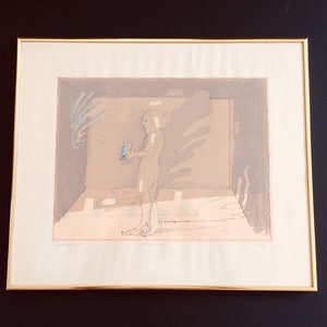 May include: A beige and brown abstract print with a figure holding a blue object. The print is titled "Waiting 1983" and signed "M. Lee".