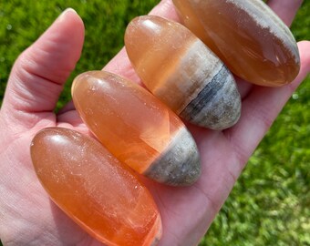 Honey Calcite Lingam Shiva Palm Stone