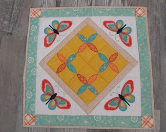 Machine embroidered appliqued table topper