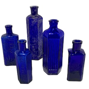 Collection five Colbolt English Poison Bottles