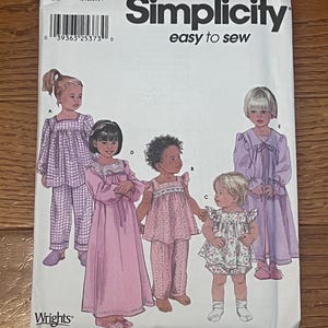 May include: A Simplicity sewing pattern for children's sleepwear. The pattern features illustrations of children in various styles of pajamas and nightgowns. The pattern includes the text "easy to sew" and the Wrights logo.