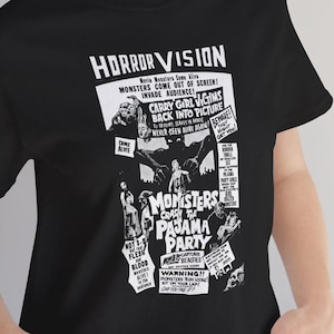 May include: Black and white graphic t-shirt featuring a vintage movie poster design for a horror film called "Monsters Crash the Pajama Party". The poster features a monster with a tagline that reads "Movie Monsters Come Alive! Monsters Come Out of Screen! Invade Audience!"