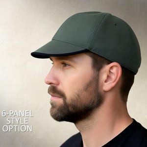 May include: A dark green 6-panel style cap with a black brim. The cap is made of a textured material and is shown from a side profile. The text "6-PANEL STYLE OPTION" is displayed in white.